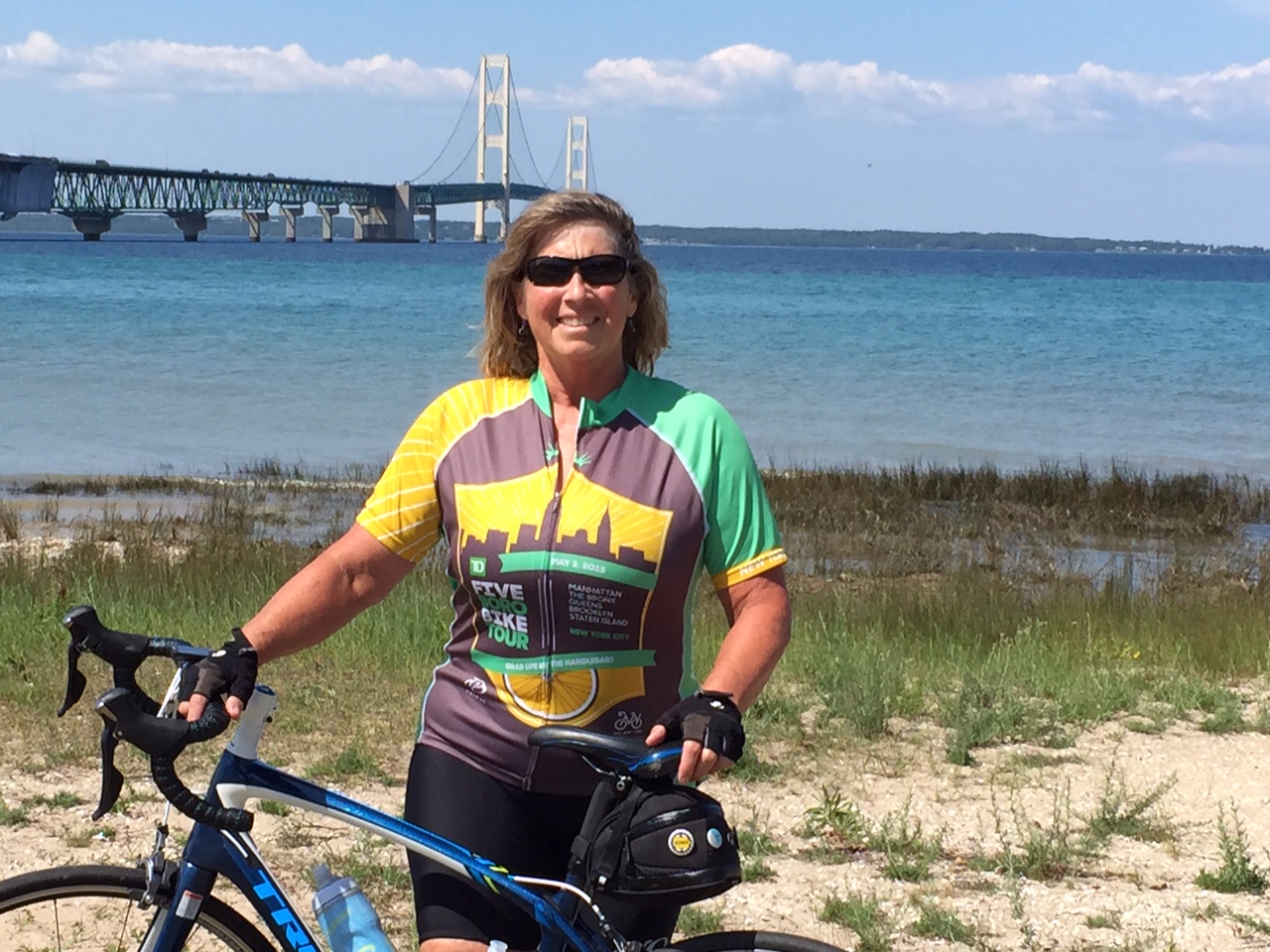 Iowa cyclist pedals her way toward $10,000 to support INHF